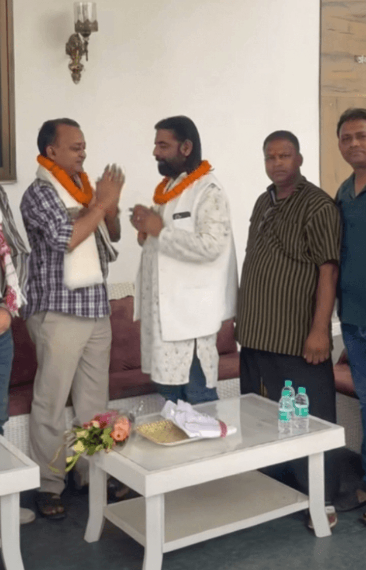 Manoj Singh greeting community members
